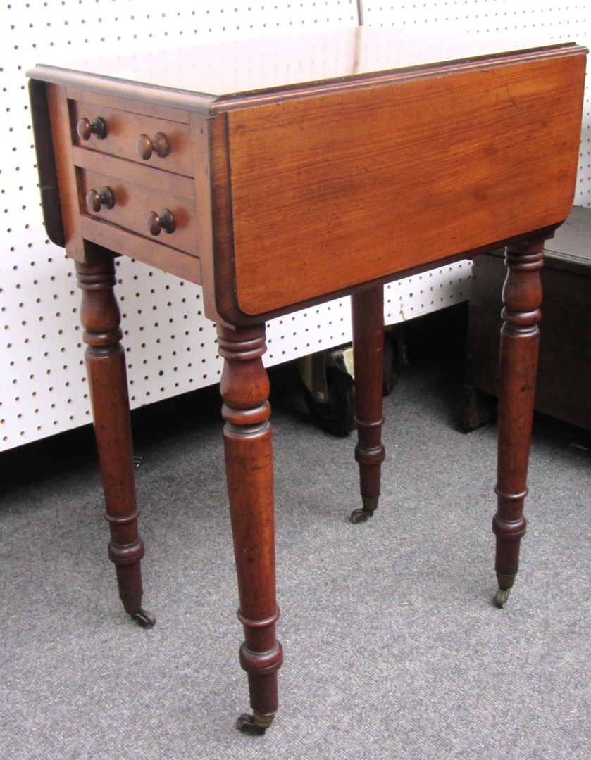 Appraisal: An early Victorian mahogany drop flap work table with pair