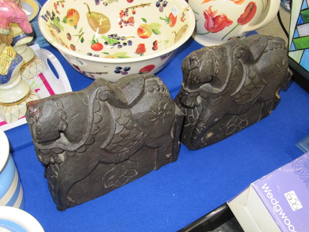 Appraisal: Pair of Chinese carved wooden horse furniture ornaments