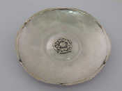 Appraisal: A silver hammered dish with applied Tudor rose to centre