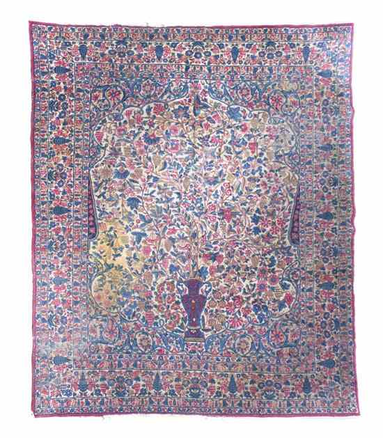 Appraisal: A Persian Wool Prayer Rug decorated with a vase issuing