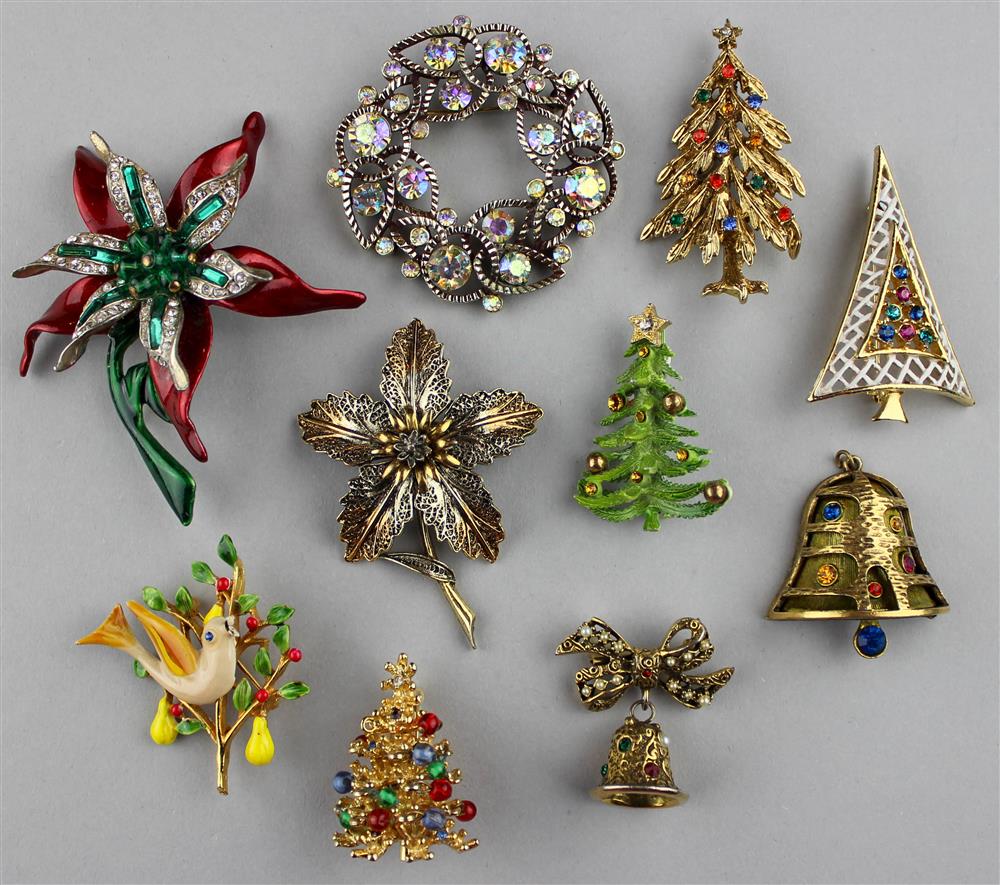 Appraisal: FOUR ART SIGNED CHRISTMAS PINS TREE BELL POINSETTIA AND PARTRIDGE