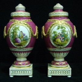 Appraisal: A pair of Berlin pink ground urn form vases and