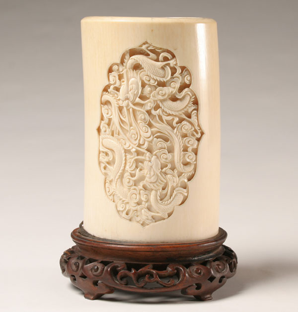 Appraisal: Carved ivory tusk cylinder vase two intricately carved scenes with