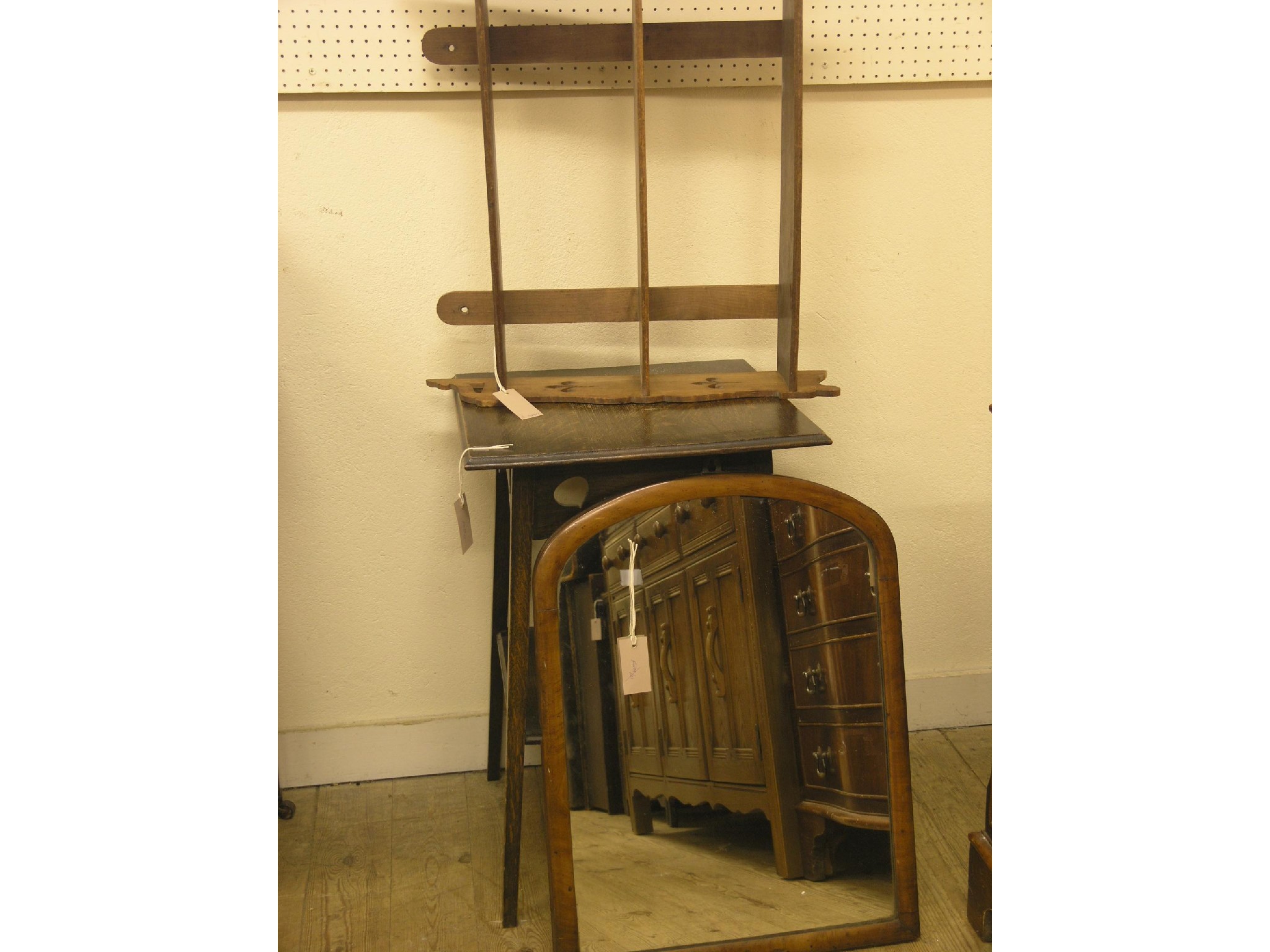 Appraisal: A dark oak two-tiered plant table in a Victorian mahogany