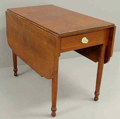 Appraisal: Sheraton cherry drop-leaf table c with a clipped corner top