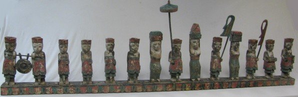 Appraisal: South Asian wood carving of fourteen polychrome painted ceremonial figures