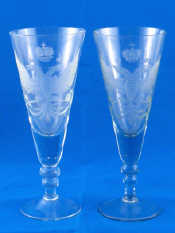 Appraisal: A pair of tall tapering wine glasses wheel engraved with