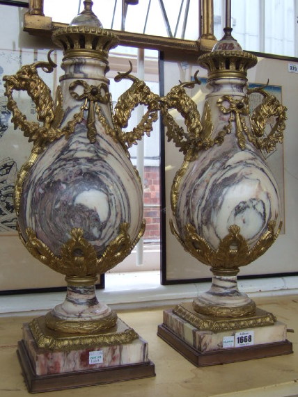 Appraisal: A pair of Breche violette marble and gilt bronze table