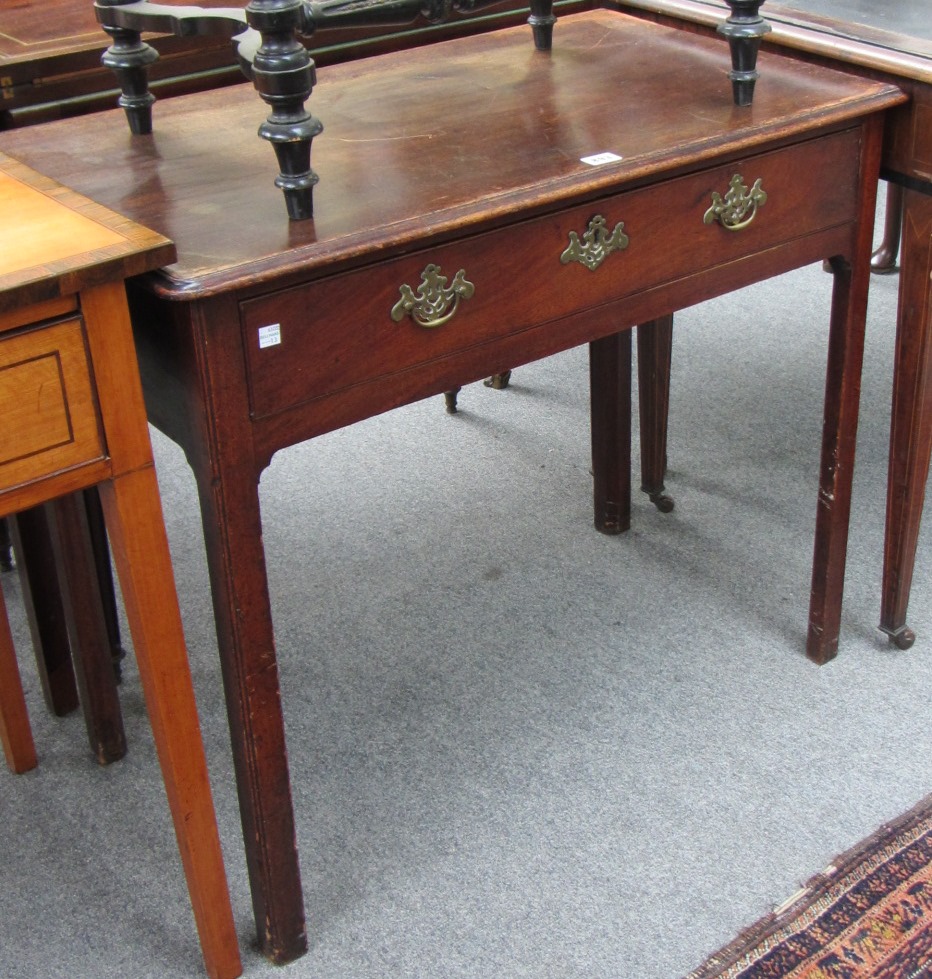 Appraisal: An th century oak single drawer side table on canted