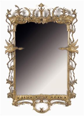 Appraisal: A giltwood wall mirror in th century style the shaped