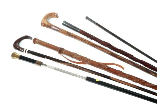 Appraisal: SIX WALKING STICKS Multicultural th century wood shafts Two with