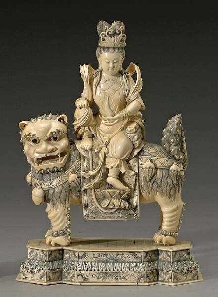 Appraisal: A pieced and tinted ivory of Wenshu on a lion