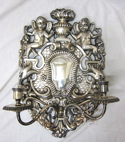 Appraisal: SILVERED BRONZE CANDLESTICK WALL SCONCE featuring a shield-form wall plaque