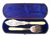 Appraisal: A pair of Victorian silver and ivory fish servers in