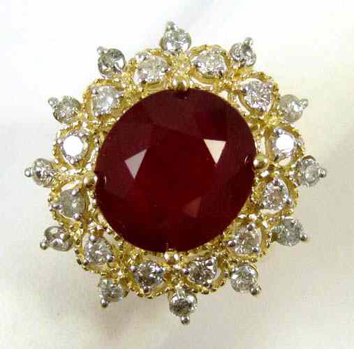 Appraisal: RUBY DIAMOND AND FOURTEEN KARAT GOLD RING round-cut diamonds surround