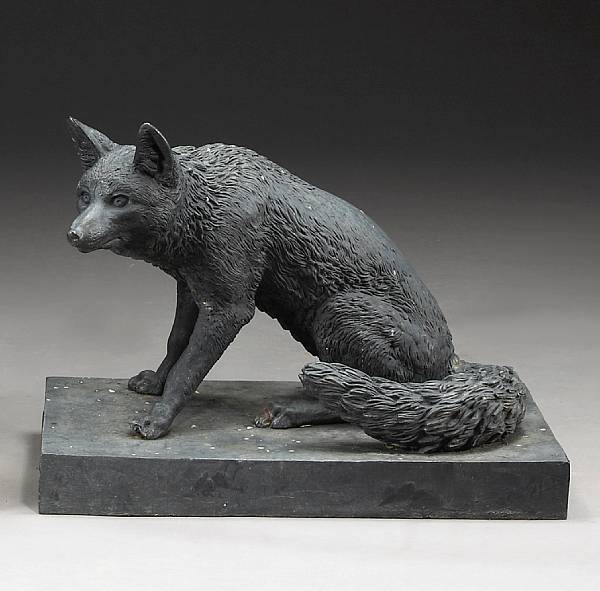 Appraisal: A French cast iron figure of a seated fox J