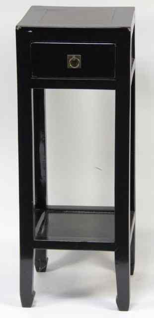 Appraisal: A Chinese ebonised bedside cupboard fitted a drawer cm wide