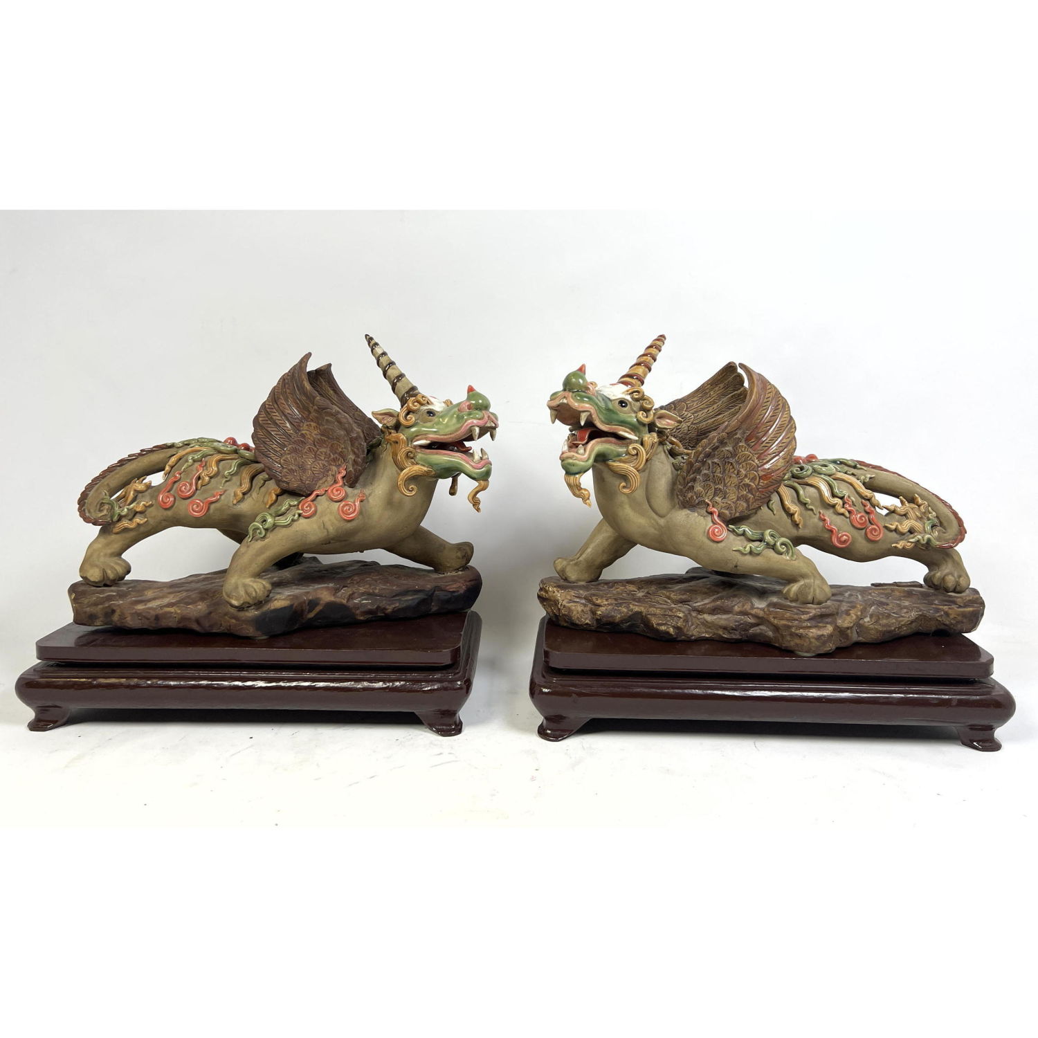 Appraisal: Pr Pottery Winged Dragon with Horn Icing decoration Pottery figures