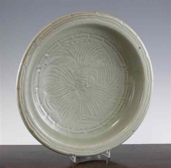 Appraisal: A Chinese celadon dish the centre carved with flowers the