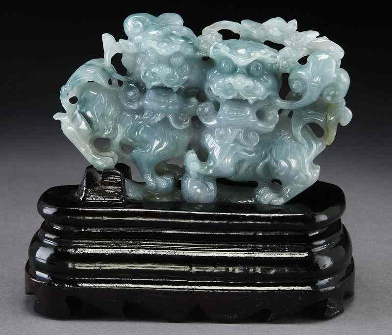 Appraisal: Chinese jadeite carving depicting two foo lions raised on a