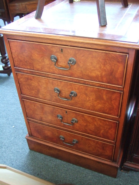 Appraisal: A reproduction walnut filing cabinet the gilt tooled brown leather