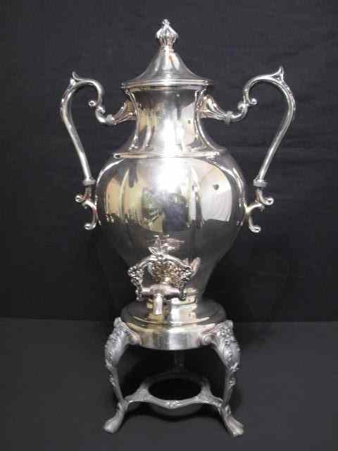 Appraisal: Victorian silverplate coffee maker On pedestal tripod Lidded with handles