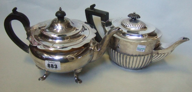 Appraisal: A silver teapot of circular form with a shaped rim