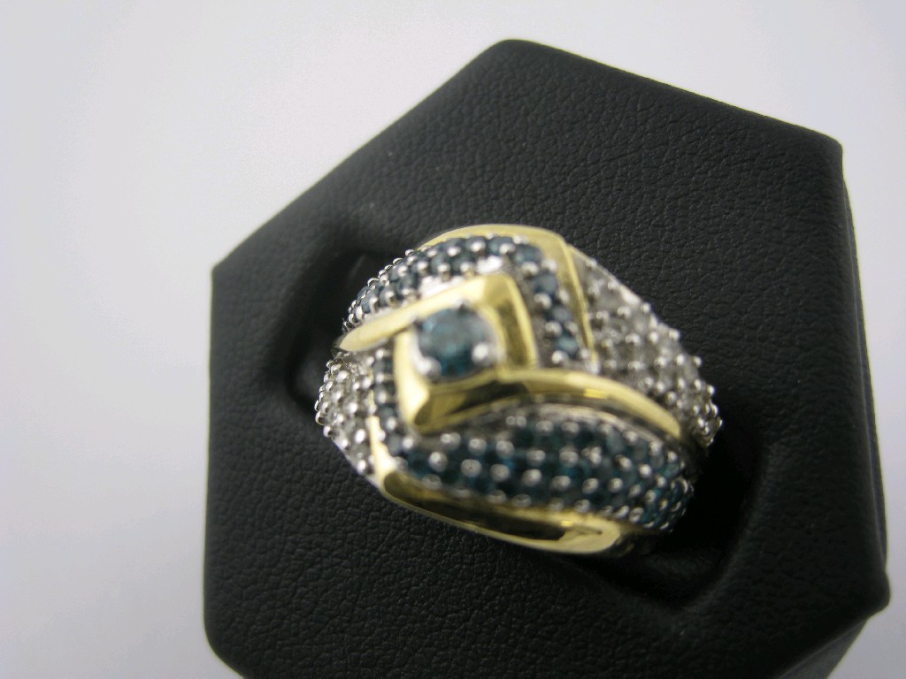 Appraisal: A Blue and White Diamond cross over Cocktail Ring the