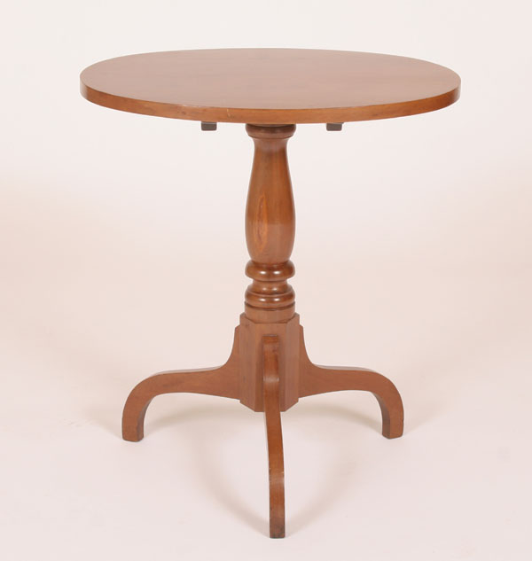 Appraisal: Oval tilt top stand table spider legs H x W