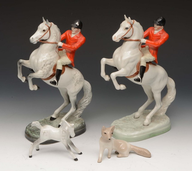 Appraisal: A PAIR OF BESWICK HUNTSMEN with red jackets on rearing