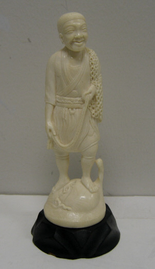 Appraisal: CARVED IVORY FIGURE OF FISHERMAN Height inches on wooden stand