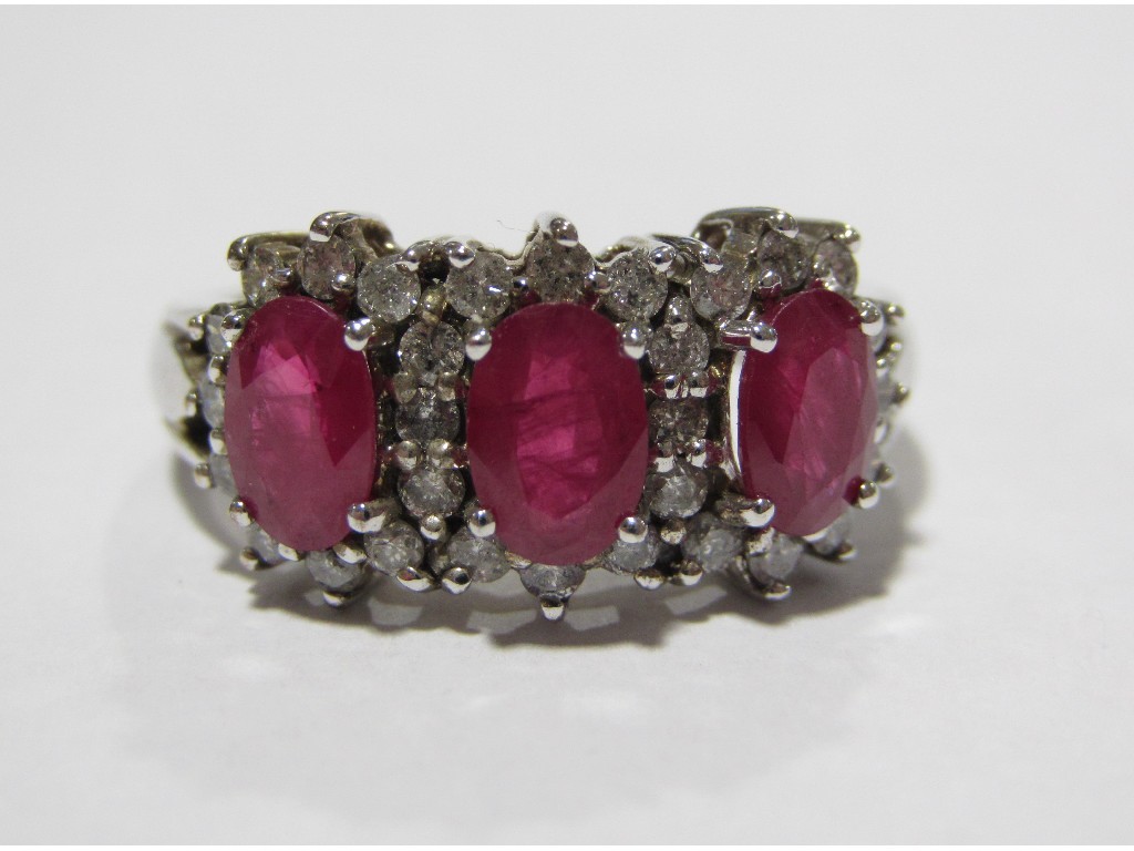 Appraisal: Eighteen carat white gold ruby and diamond triple flower head