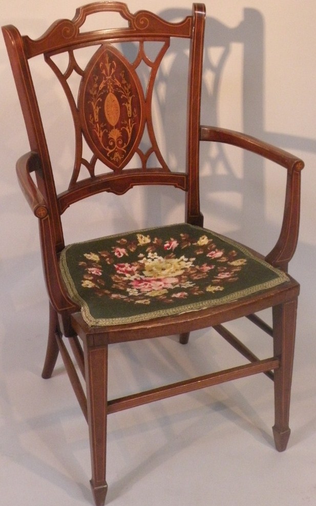 Appraisal: An Edwardian mahogany painted and boxwood strung elbow chair with