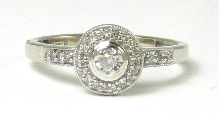 Appraisal: DIAMOND AND TEN KARAT WHITE GOLD RING with round-cut diamonds