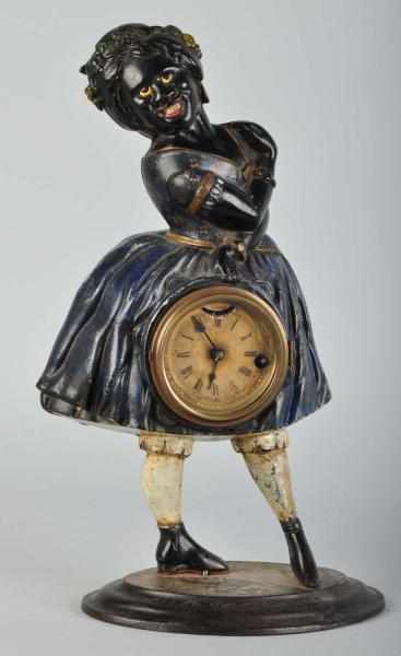 Appraisal: Cast Iron Topsy Clock with Moving Eyes Description Circa Paint