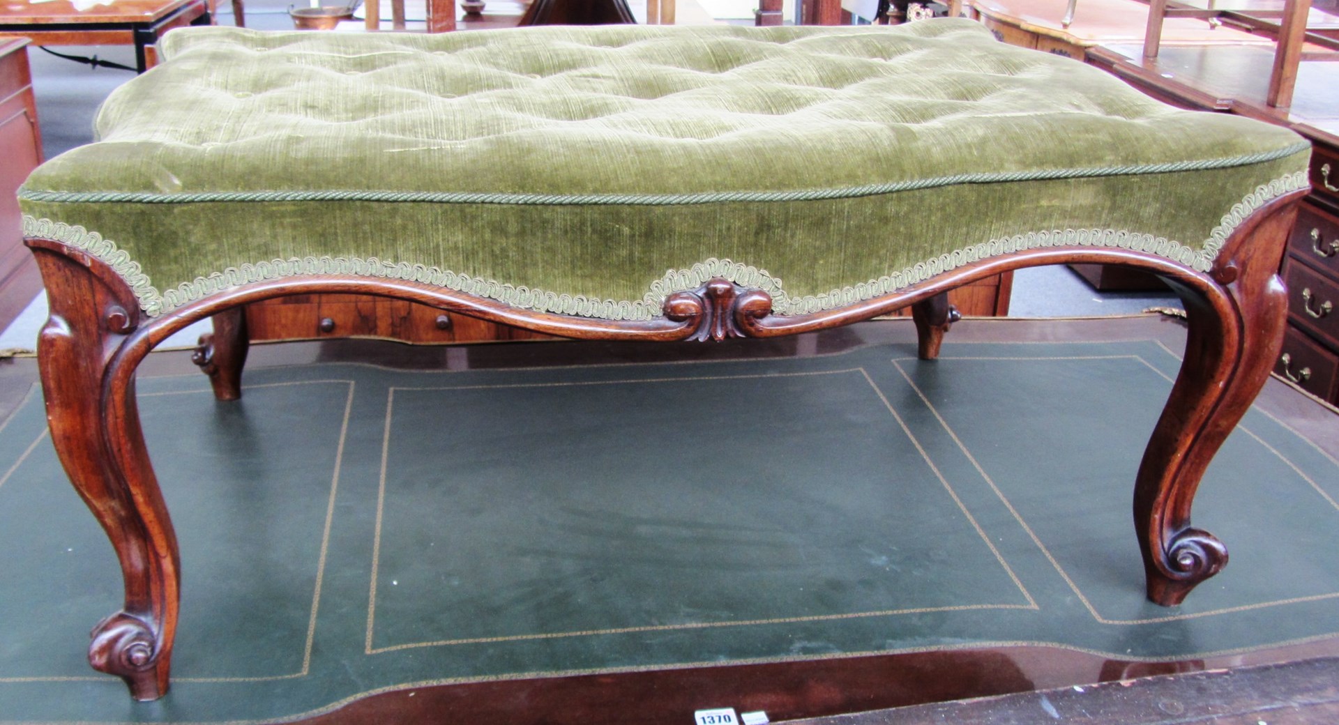 Appraisal: An early Victorian rosewood framed footstool of serpentine outline on