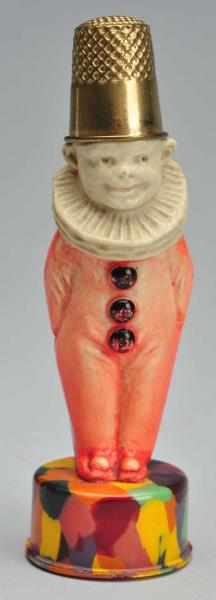 Appraisal: Clown Figural Tape Measure Thimble Holder Description German Celluloid Original