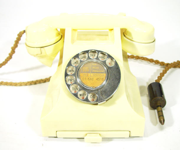 Appraisal: Ivory Bakelite dial telephone with drawer to base numbered L