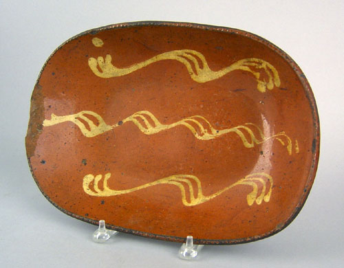 Appraisal: Redware loaf dish th c with yellow slip decoration h