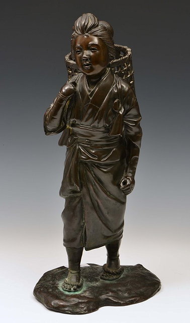 Appraisal: A JAPANESE BRONZE MODEL of a girl holding a basket