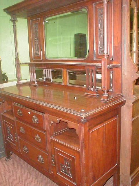 Appraisal: A late Victorian walnut Art Nouveau mirror backed sideboard wide