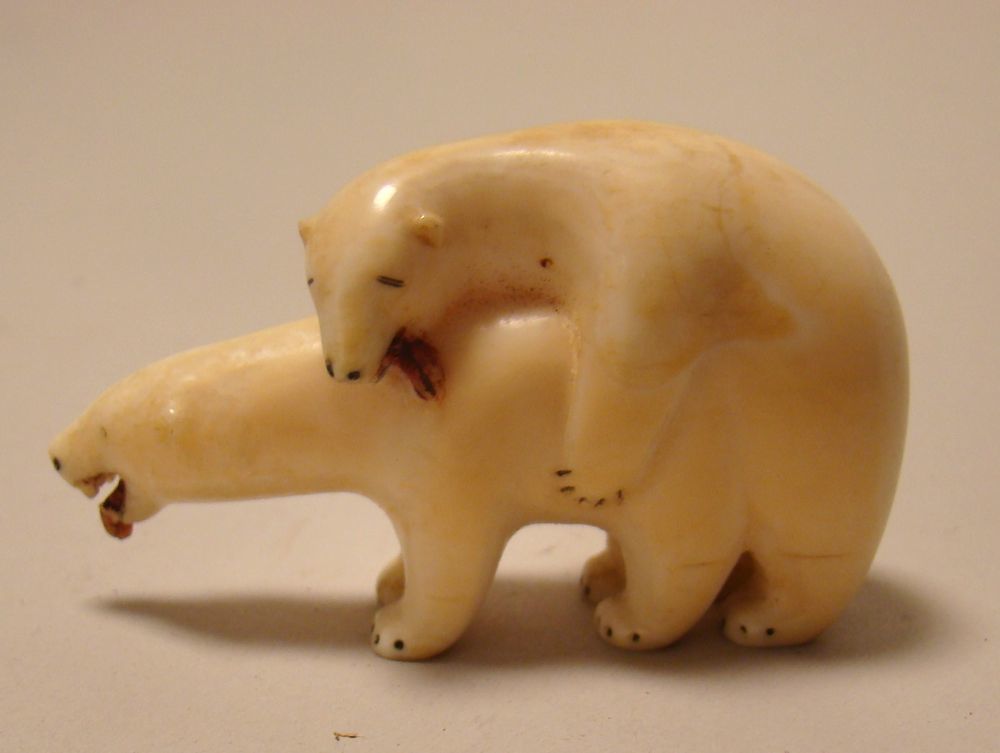 Appraisal: CARVED IVORY FIGURE GROUP Of two polar bears in an