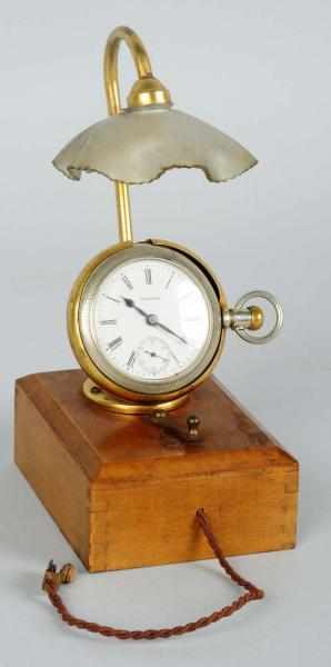 Appraisal: Light-Up Watch Holder with Wooden Base Working Condition Excellent Size