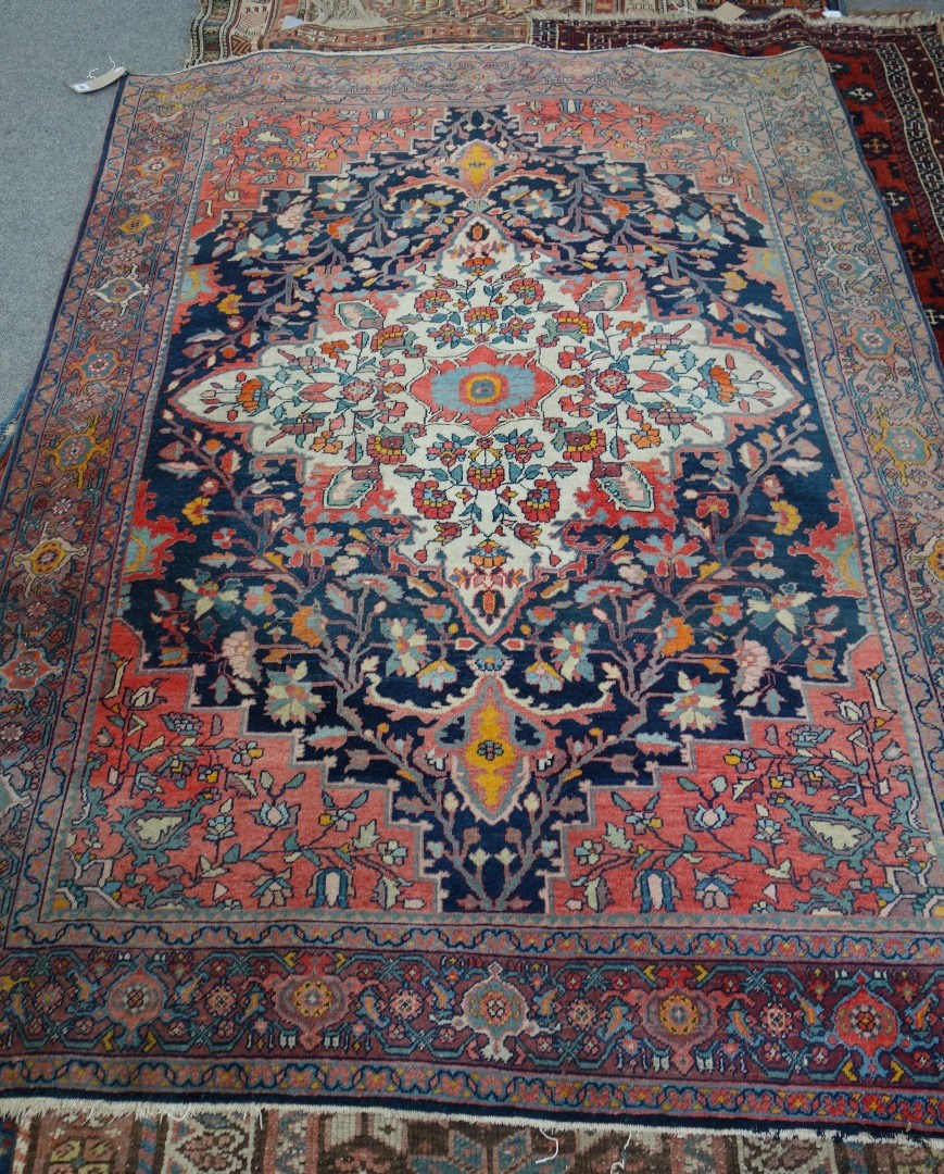 Appraisal: A Malayer rug Persian the indigo field with a bold