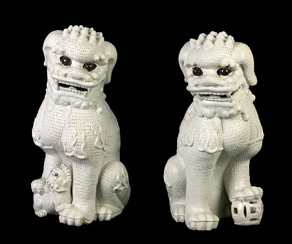 Appraisal: A pair of Chinese blanc de chine temple lions height