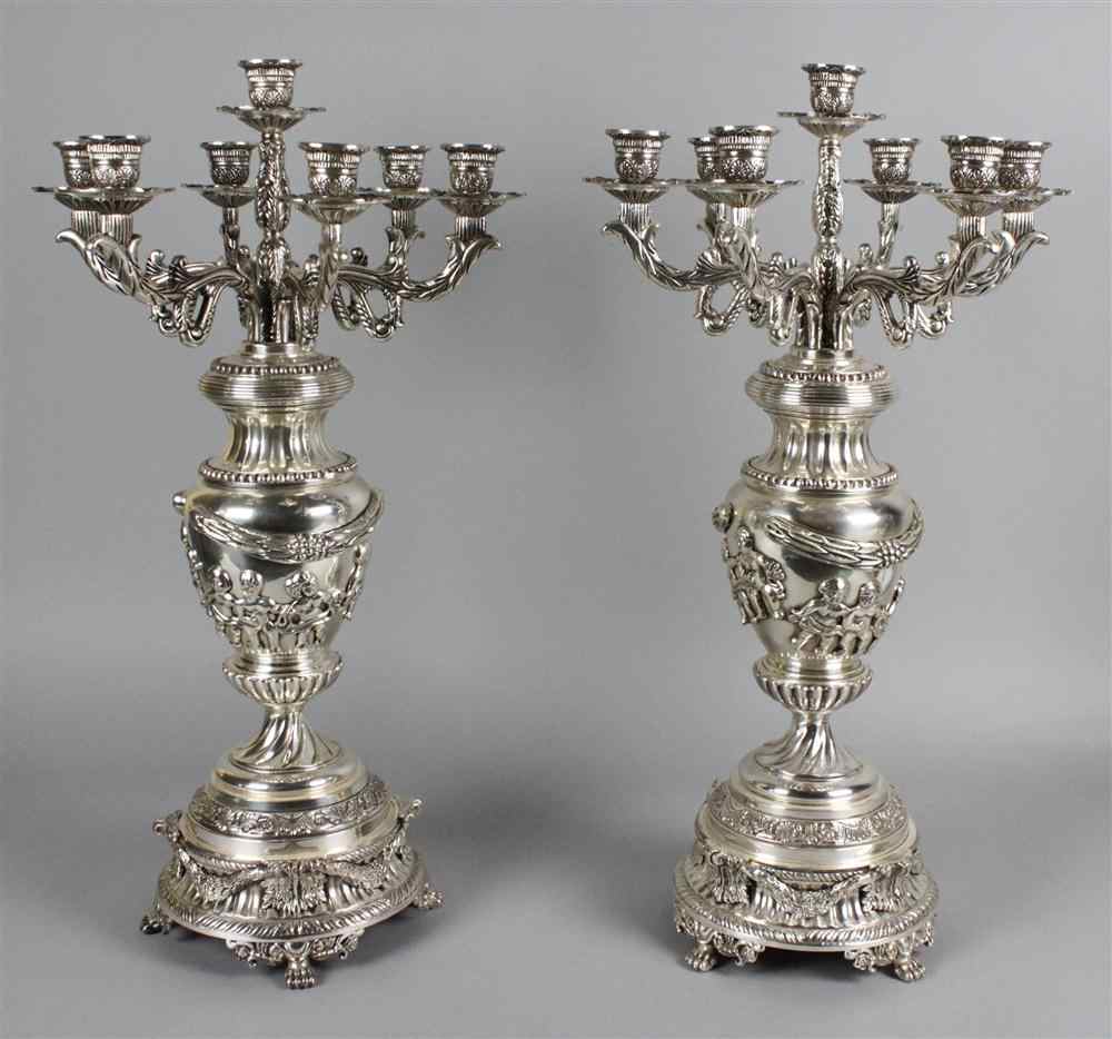 Appraisal: PAIR OF LARGE SILVER PLATED CANDELABRA the seven candle branches