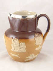 Appraisal: A Doulton ceramic harvest jug with hallmarked sterling silver rim