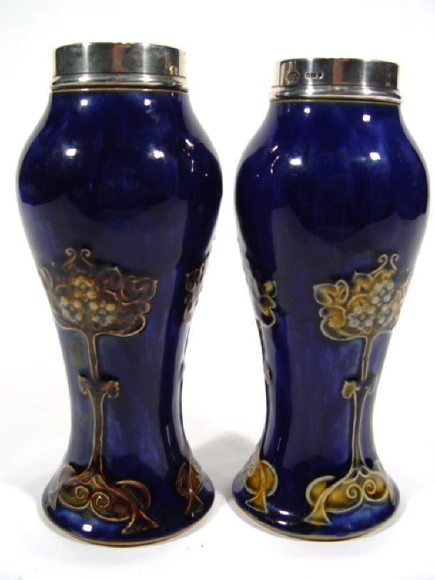 Appraisal: Pair of Royal Doulton stoneware baluster vases with silver tops