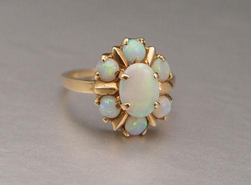 Appraisal: ANTIQUE OPAL RING K yellow gold ring contains one x