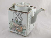 Appraisal: A Chinese teapot complete with infuser the lid with heart